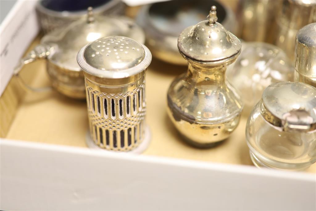 Eight assorted silver condiments including pair of Victorian mounted glass and a Georgian bun salt etc.